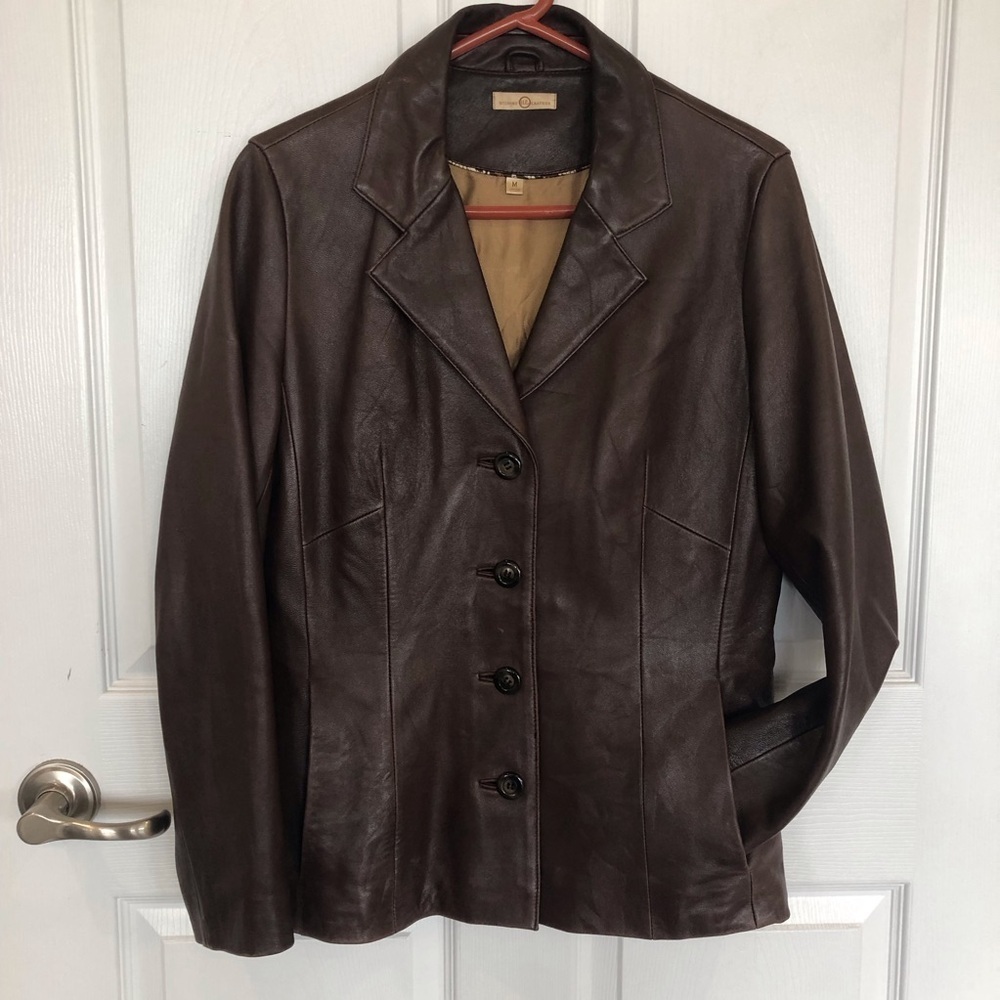 Wilson’s Leather chocolate brown leather jacket lined pockets. Buttons to fasten